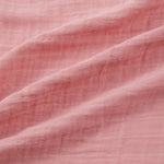 Close-up of pink swaddle with visible texture