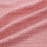 Close-up of pink swaddle with visible texture