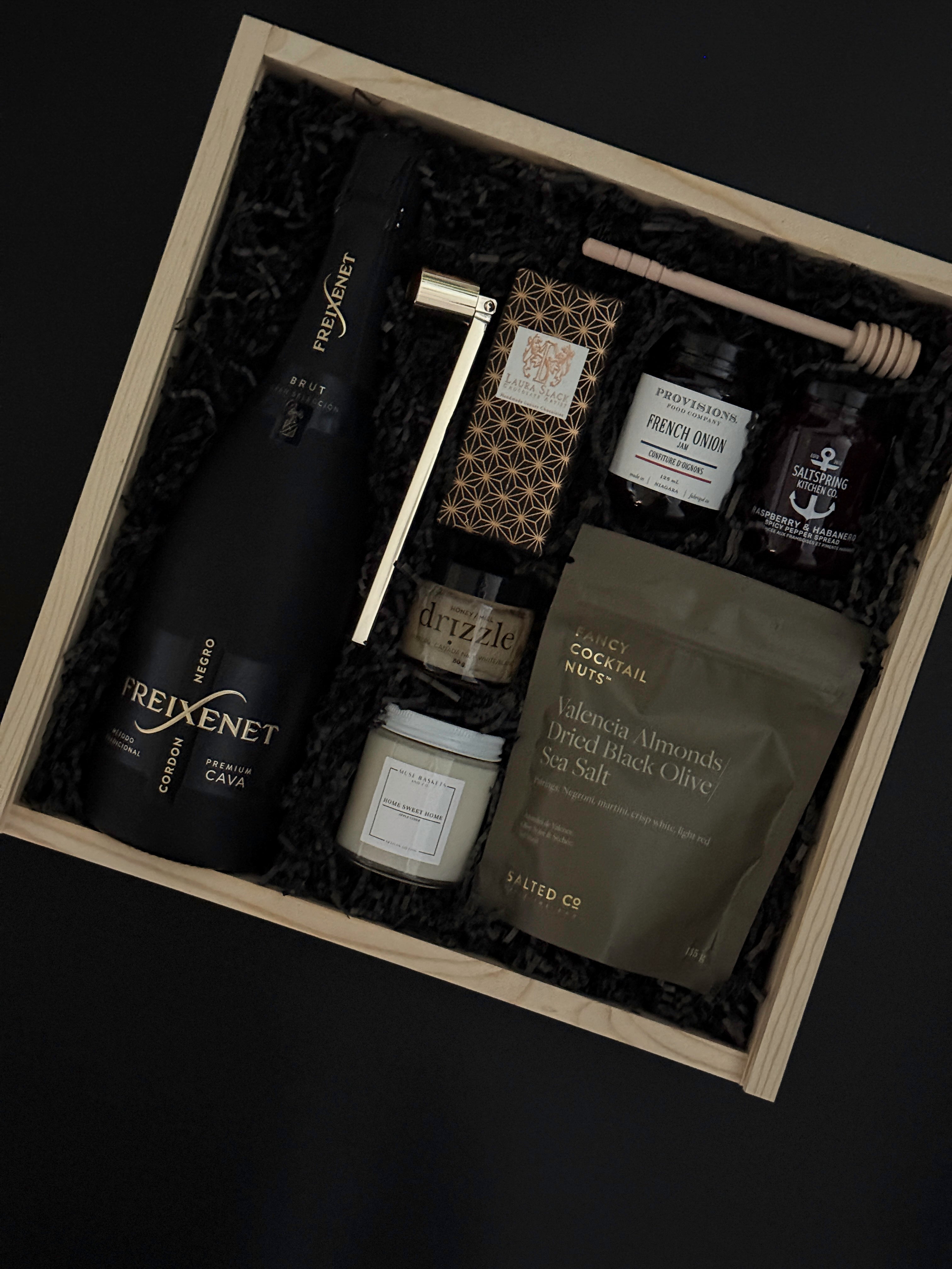 Realtor closing gift box featuring cava, spreads, chocolate, and candle.