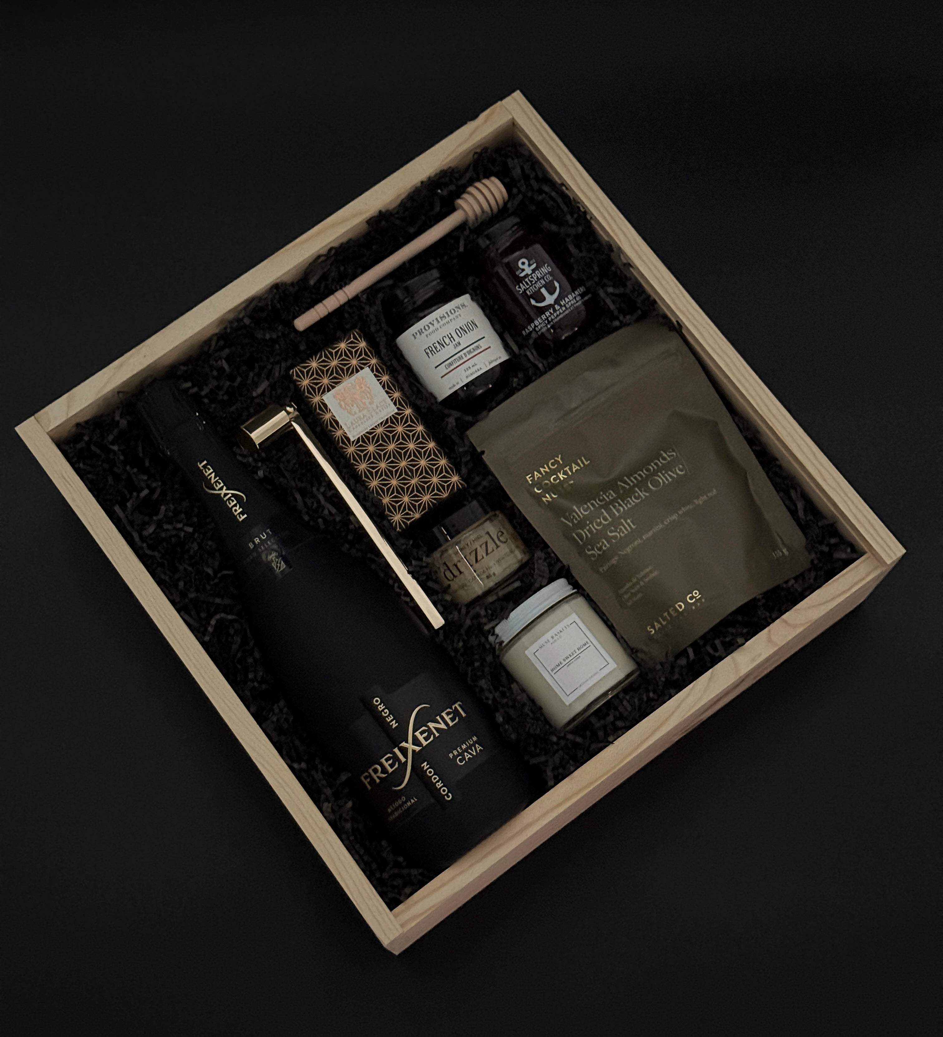 Maison Noir gift box with Freixenet cava, gourmet spreads, and “Home Sweet Home” candle.