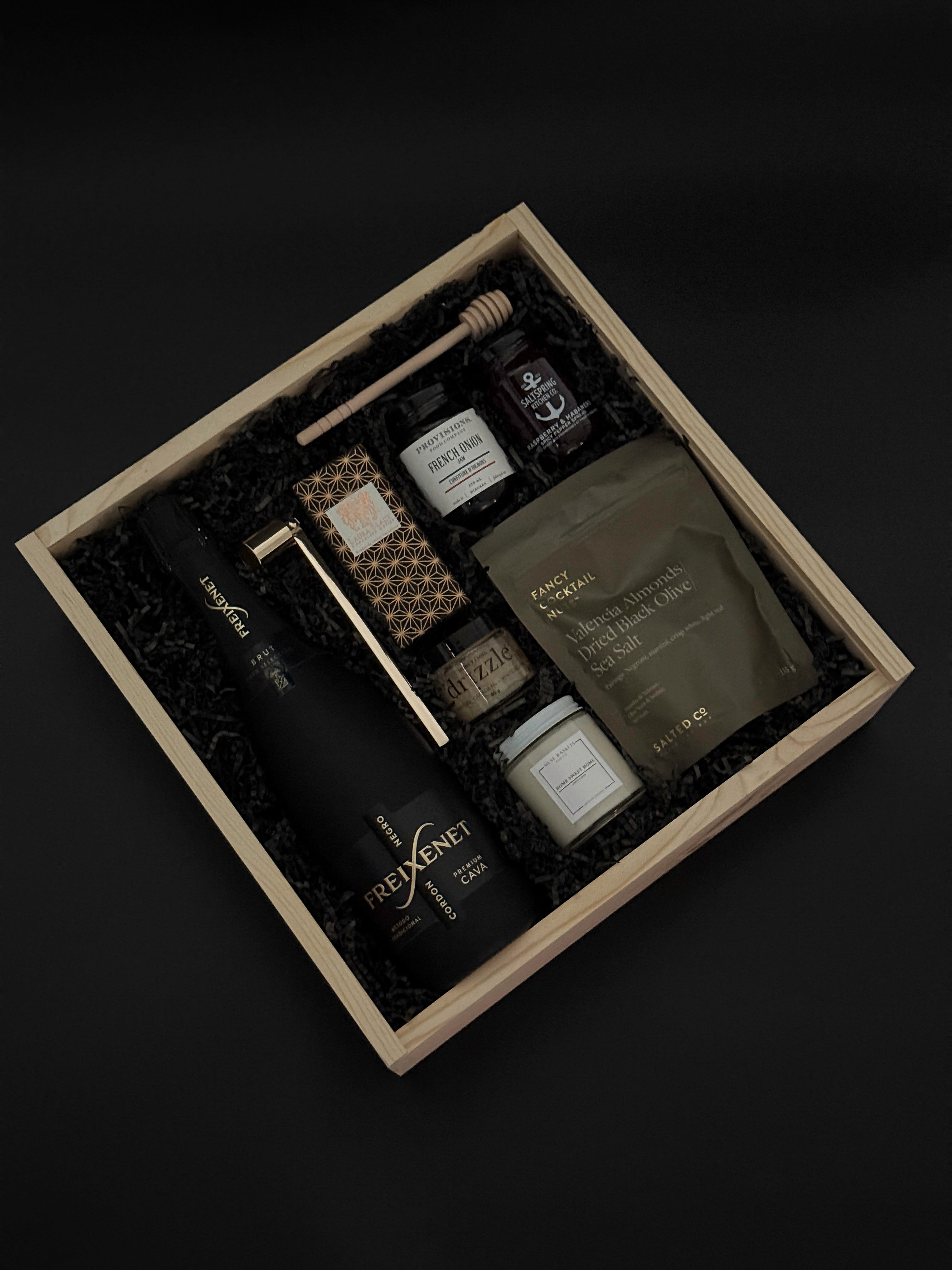Maison Noir gift box with Freixenet cava, gourmet spreads, and “Home Sweet Home” candle.