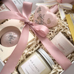 Grounded Serenity bridal gift box by Muse Baskets and Co., presented in a pearl white box with satin ribbon and preserved flowers.