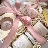 Grounded Serenity bridal gift box by Muse Baskets and Co., presented in a pearl white box with satin ribbon and preserved flowers.