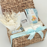 Woven gift basket with a white bow on a light background