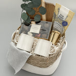 Two white stoneware tea mugs with grey cloth napkin, ready for a relaxing tea moment