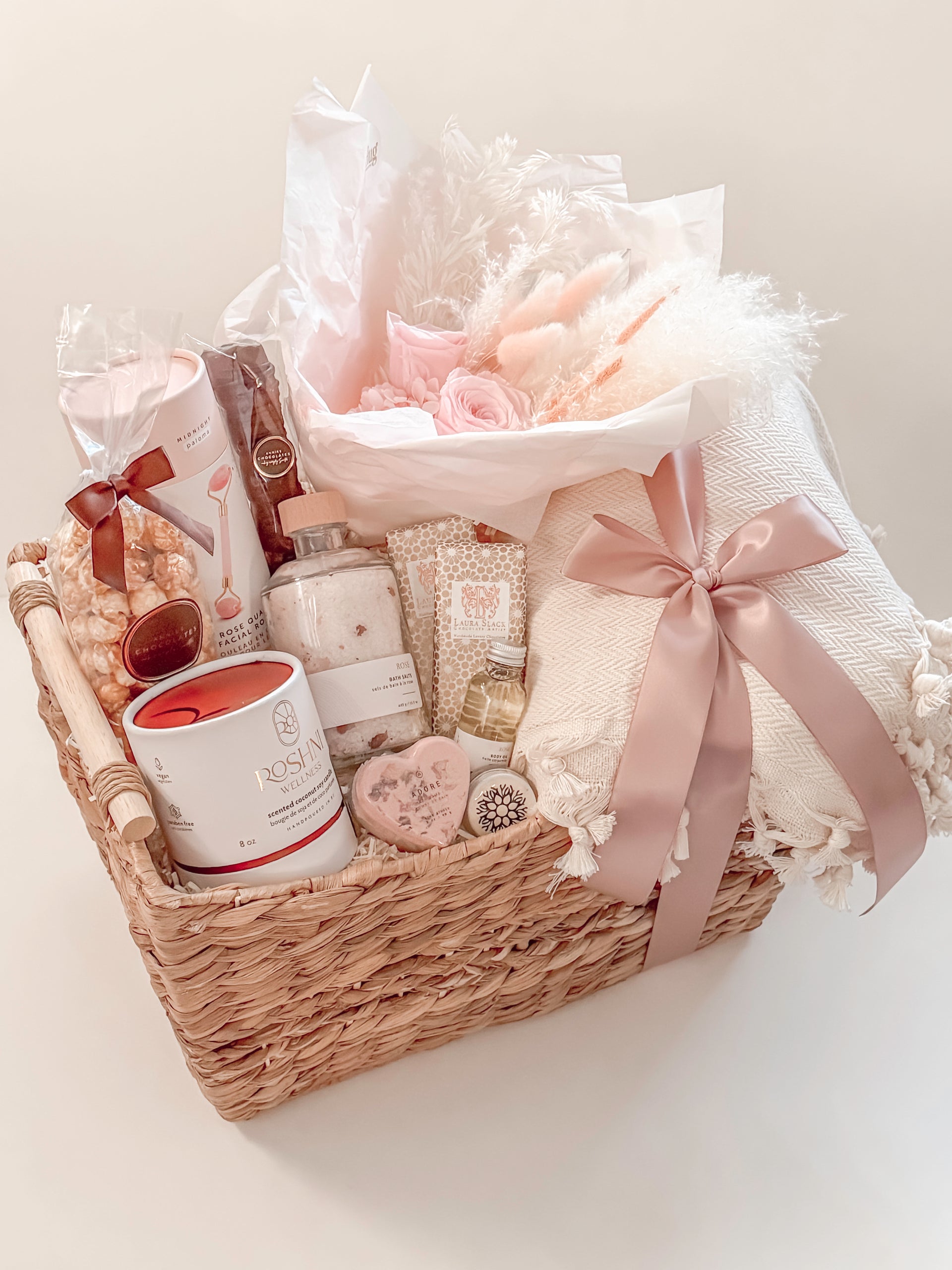 bespoke gift basket for teacher with preserved florals, throws, chocolates and luxury candles.