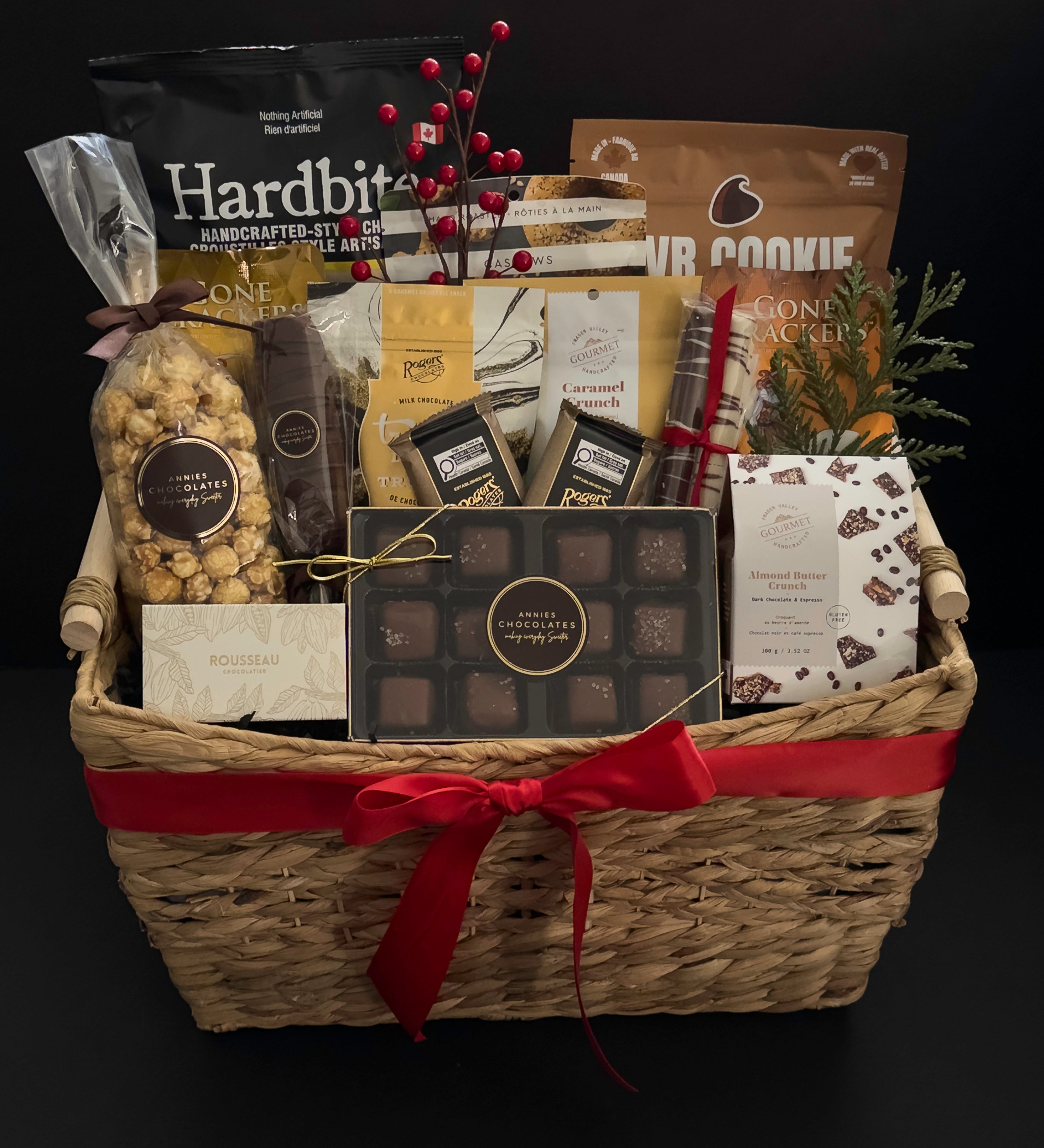 The Holiday Gathering holiday gift basket by Muse Baskets and Co. with artisan chocolates, crackers, gourmet popcorn and sweet and savoury Canadian provisions for corporate holiday gifting.