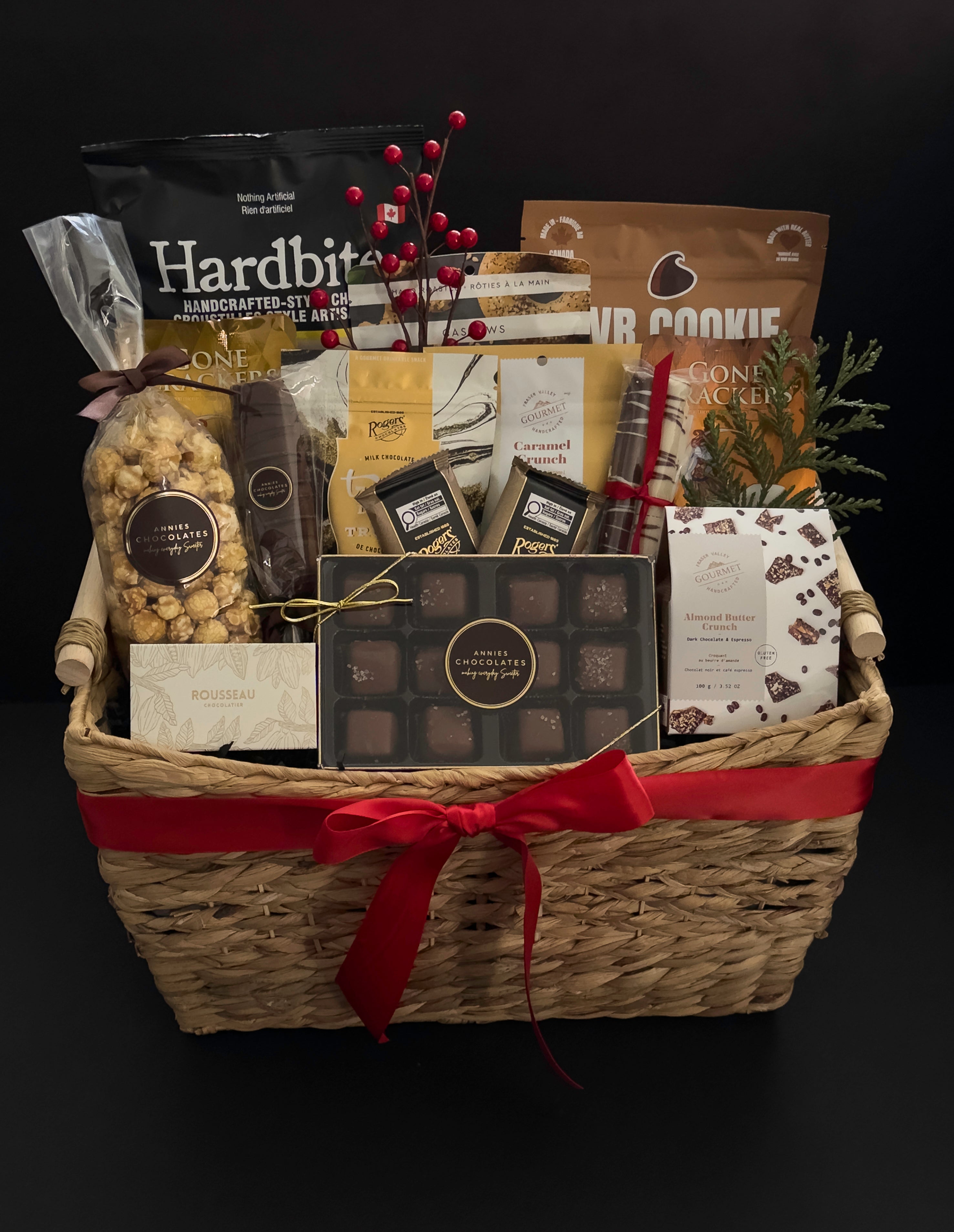 The Holiday Gathering holiday gift basket by Muse Baskets and Co. with artisan chocolates, crackers, gourmet popcorn and sweet and savoury Canadian provisions for corporate holiday gifting.