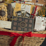 The Holiday Gathering Basket by Muse Baskets and Co. arranged with artisan sweets, savoury snacks, gourmet popcorn and crackers for office holiday celebrations.