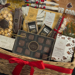 Luxury holiday gift basket by Muse Baskets and Co. with chocolates, caramels, savoury snacks, artisan crackers and satin ribbon for Vancouver holiday gifting.