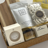 Harvest & Honey gift basket by Muse Baskets and Co. featuring Canadian-made tea, candle, honey, soap, bath bomb and white chocolate pretzels for seasonal gifting.