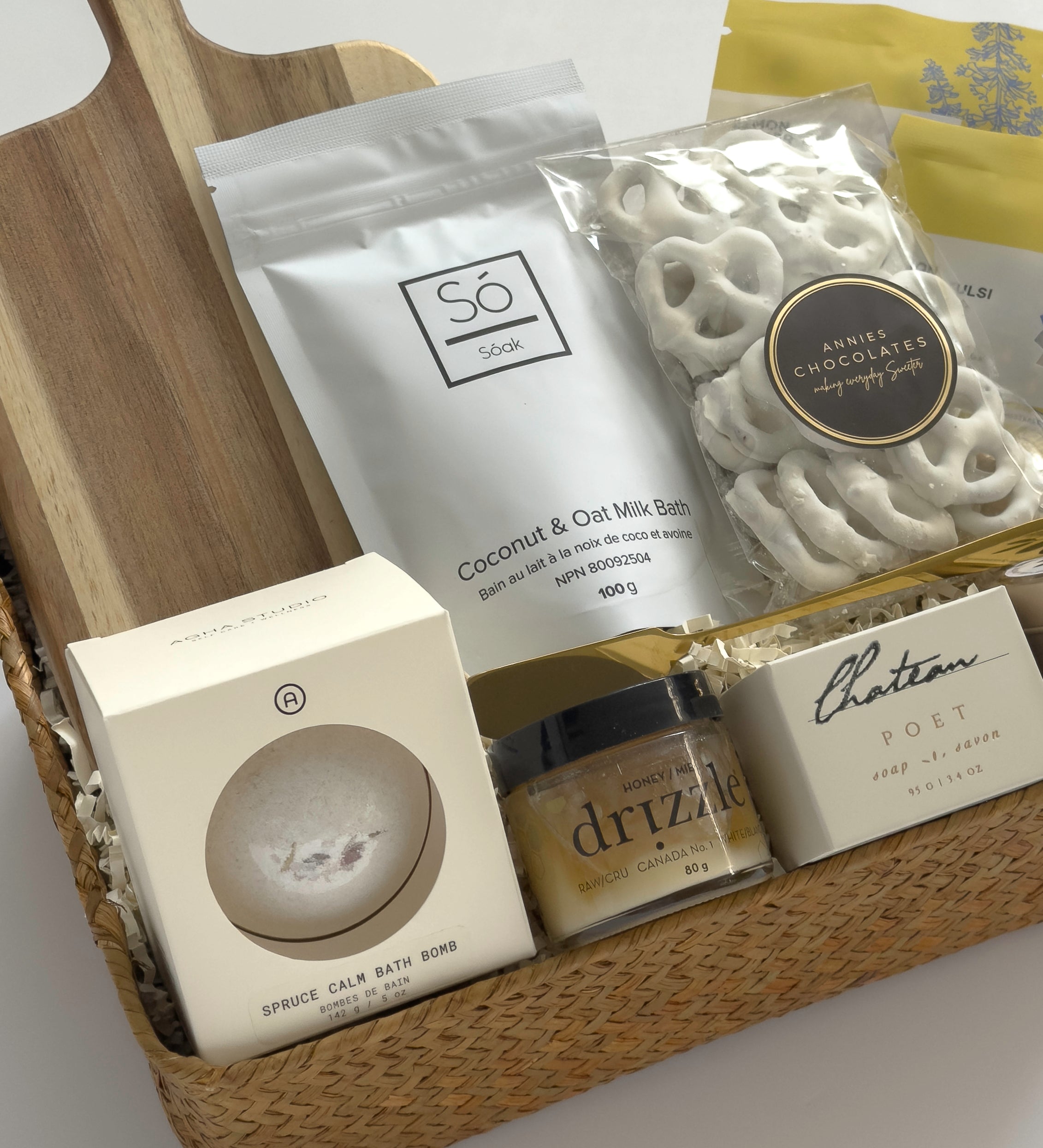Harvest & Honey gift basket by Muse Baskets and Co. featuring Canadian-made tea, candle, honey, soap, bath bomb and white chocolate pretzels for seasonal gifting.