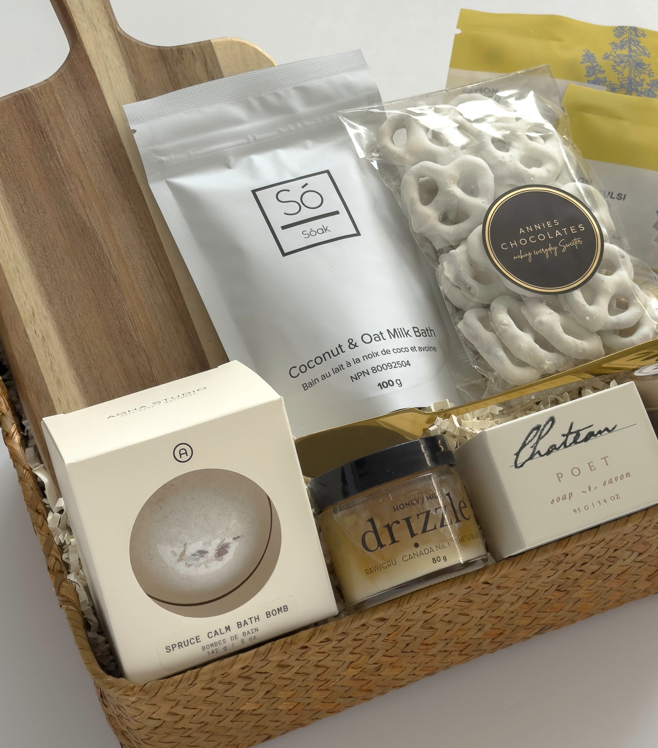 Harvest & Honey gift basket by Muse Baskets and Co. featuring Canadian-made tea, candle, honey, soap, bath bomb and white chocolate pretzels for seasonal gifting.
