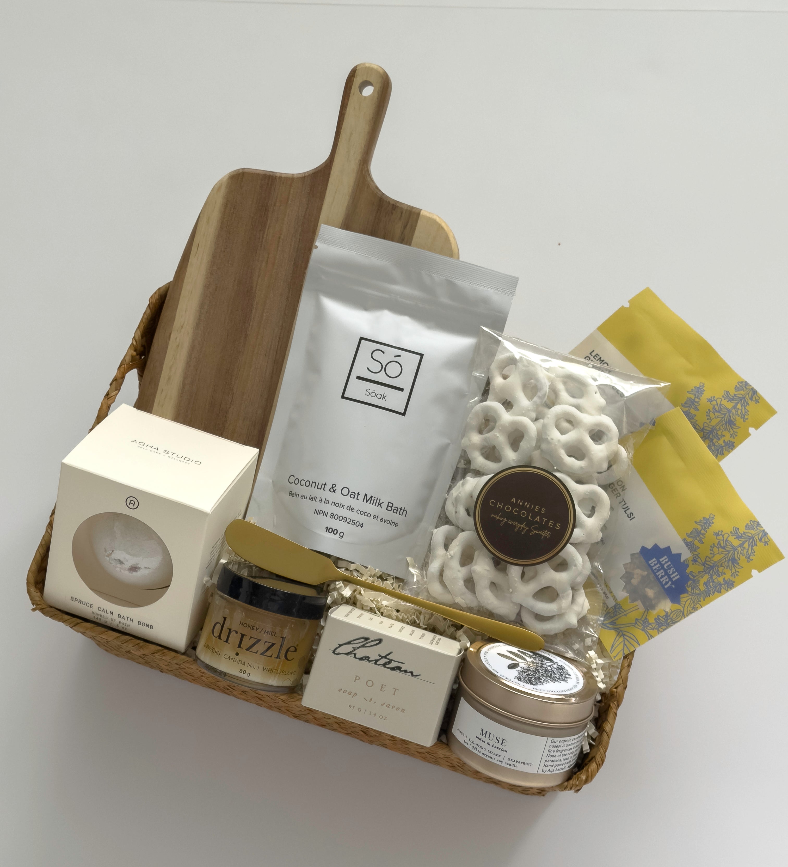 Woven Thanksgiving hostess gift basket by Muse Baskets and Co. with pantry, home and self-care items curated for hosts, clients and homeowners.