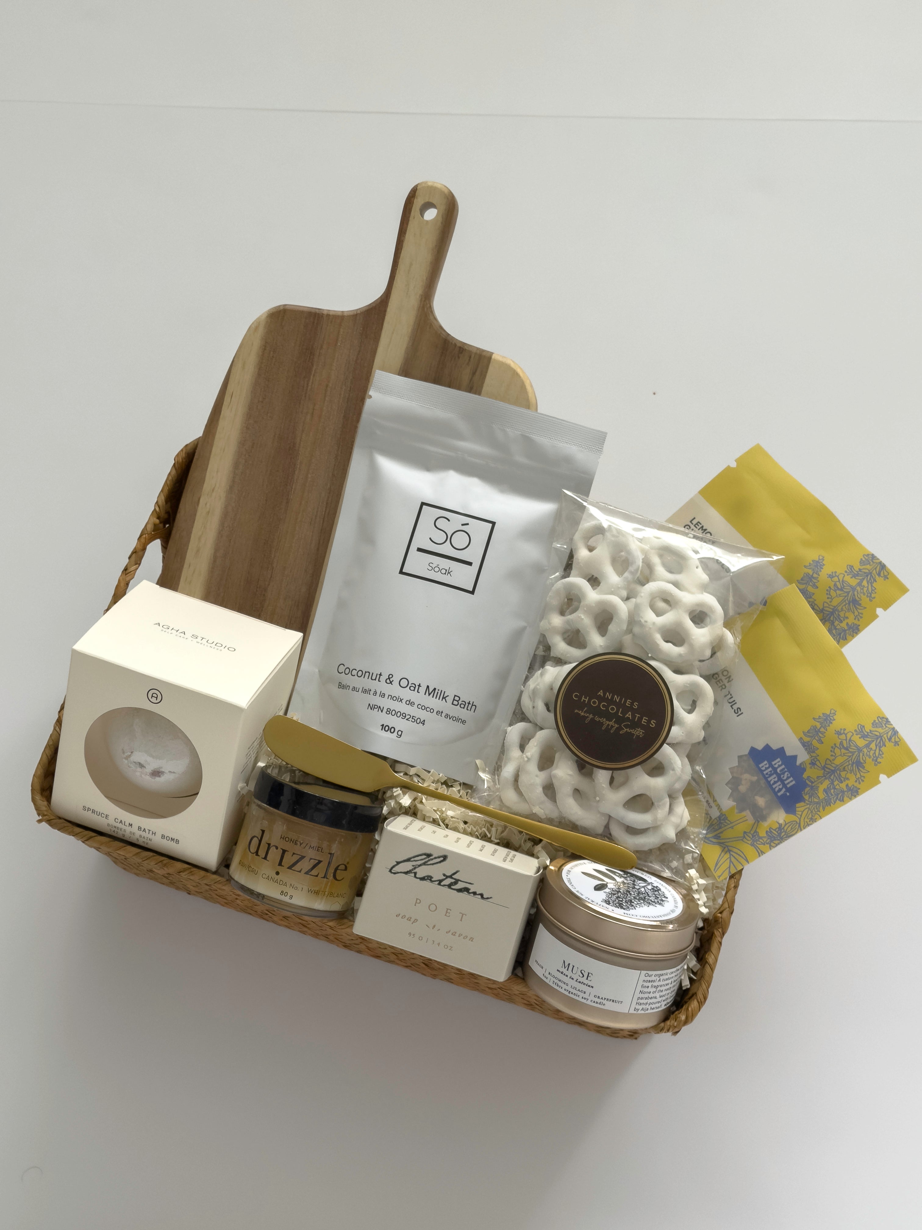 Woven Thanksgiving hostess gift basket by Muse Baskets and Co. with pantry, home and self-care items curated for hosts, clients and homeowners.