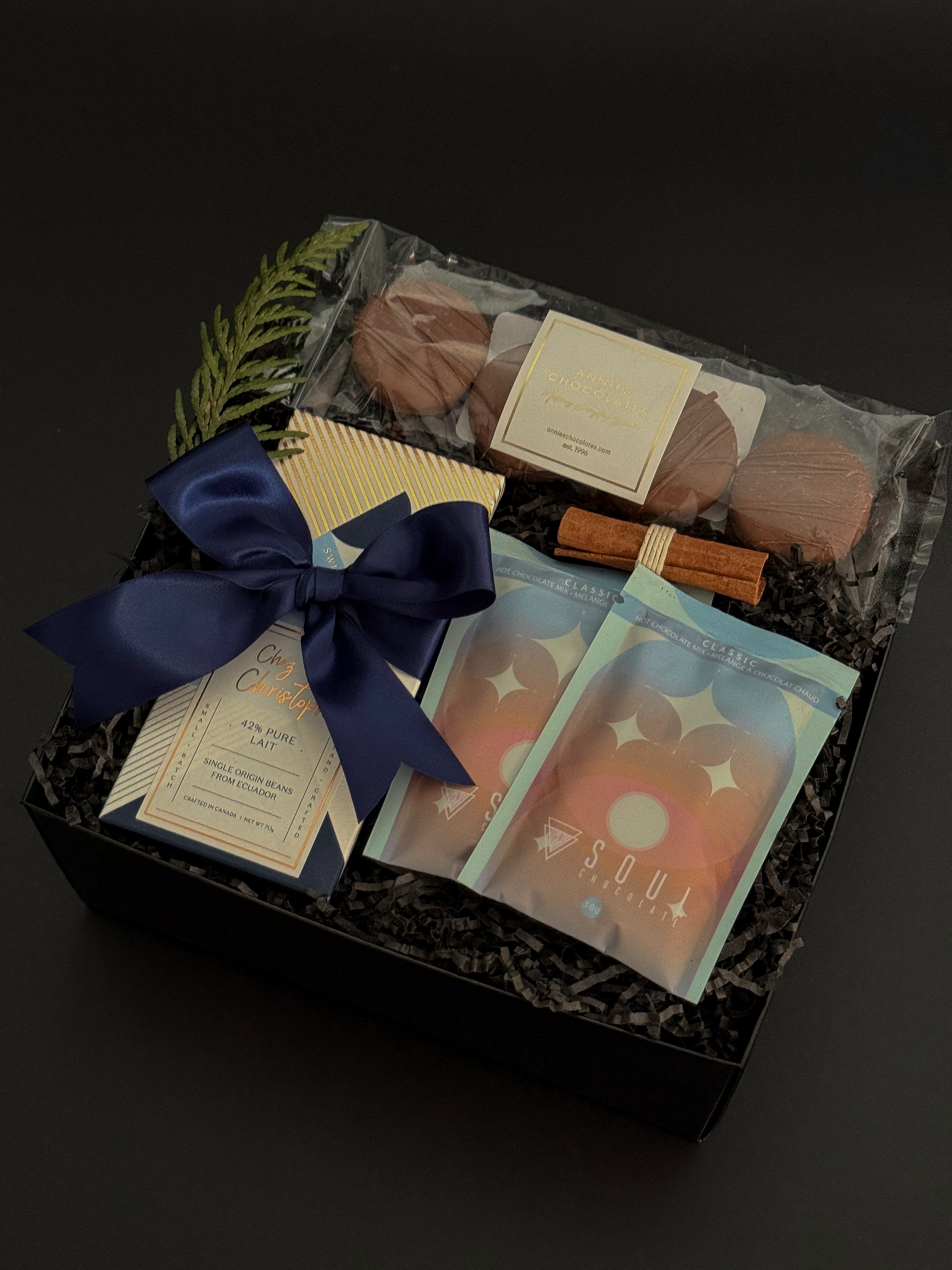 Luxury chocolate gift box featuring hot chocolate mixes, artisan chocolate, and cookies — perfect for corporate and holiday gifting.