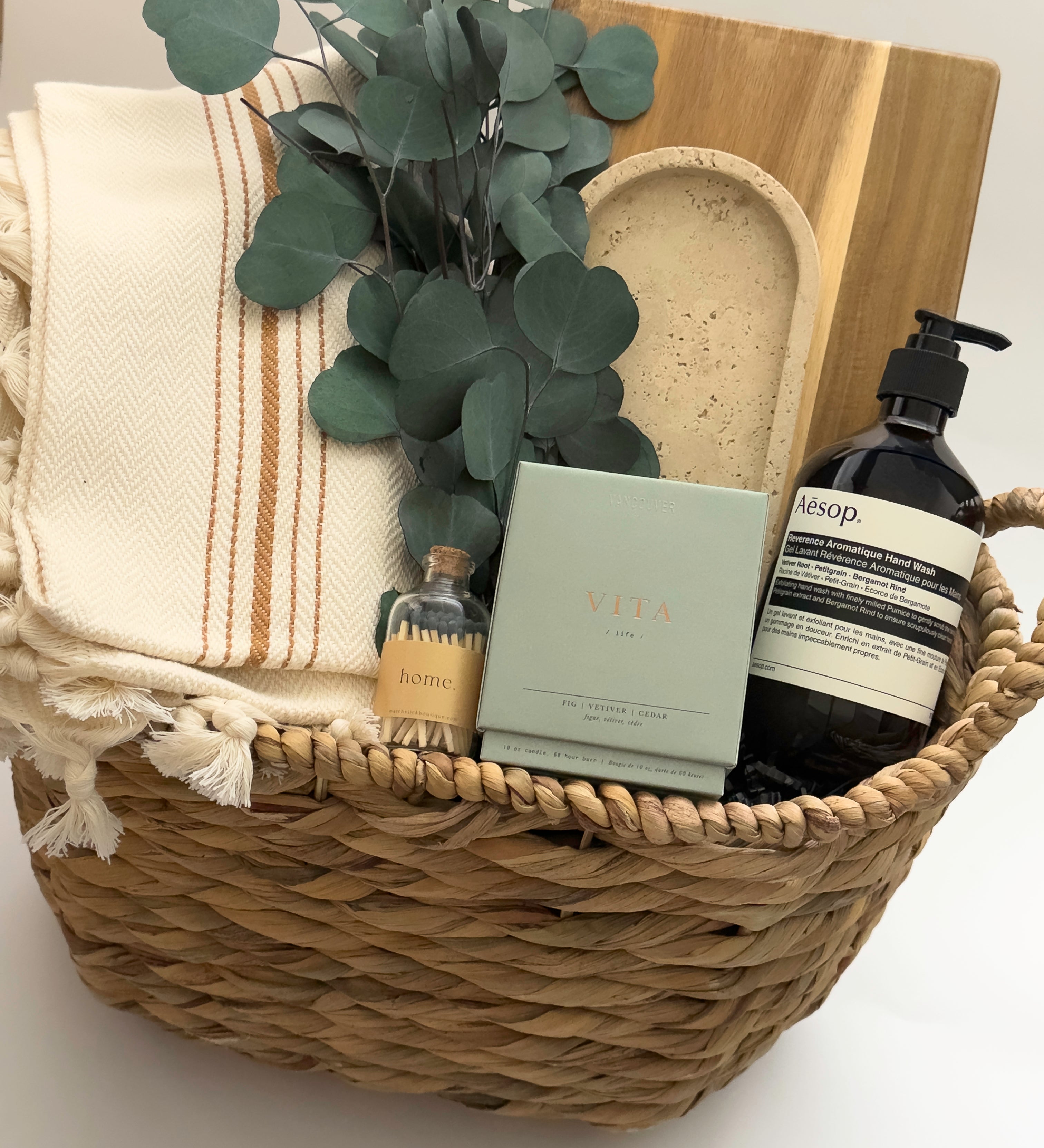 Demeure luxury gift box by Muse Baskets and Co. Vancouver with Vita candle Aesop Reverence hand wash and cream striped Turkish throw