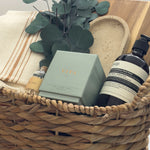 Luxury housewarming gift box Demeure by Muse Baskets Vancouver with acacia board travertine tray Turkish throw and Aesop hand wash