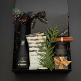 The Marlowe Christmas gift box by Muse Baskets and Co. presented in a signature onyx box for corporate holiday gifting.