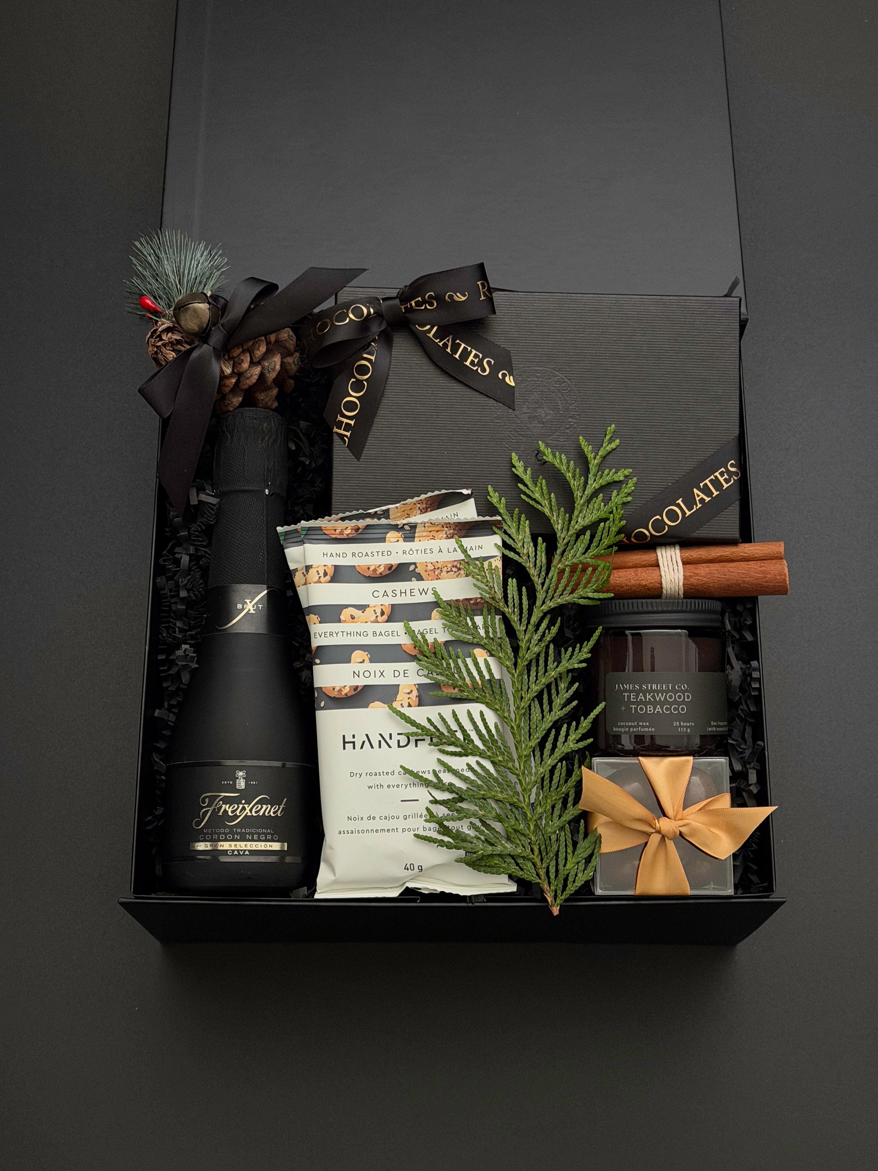 The Marlowe Christmas gift box by Muse Baskets and Co. presented in a signature onyx box for corporate holiday gifting.