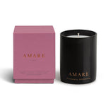 Vancouver Candle Co. Amare candle in peony, jasmine, and ylang ylang, shown beside its pink packaging, a premium candle featured in Muse Baskets and Co. corporate gift baskets