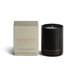 Vancouver Candle Co. Silentium candle in bergamot, lavender, and musk, shown beside its packaging, a premium candle featured in Muse Baskets and Co. corporate gift baskets