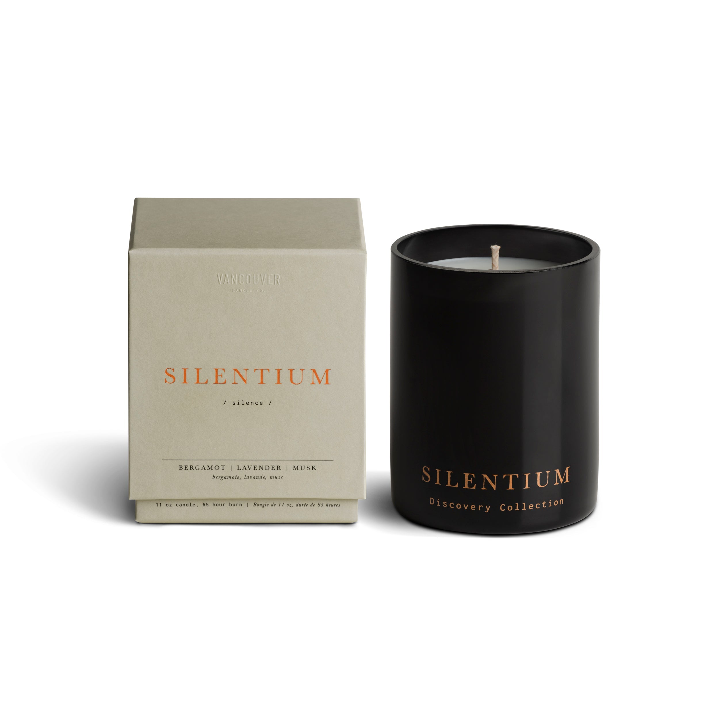 Vancouver Candle Co. Silentium candle in bergamot, lavender, and musk, shown beside its packaging, a premium candle featured in Muse Baskets and Co. corporate gift baskets