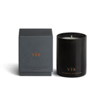 Vancouver Candle Co. Vis candle in myrrh, amber, and sandalwood, shown beside its packaging, a premium candle featured in Muse Baskets and Co. corporate gift baskets