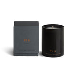 Vancouver Candle Co. Vis candle in myrrh, amber, and sandalwood, shown beside its packaging, a premium candle featured in Muse Baskets and Co. corporate gift baskets