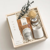 Warm Welcome realtor closing gift by Muse Baskets and Co. with Poet reed diffuser, Masala chai, gold tea steeper, soy candle and Fable mug in a Signature Luxe Wood Gift Box.