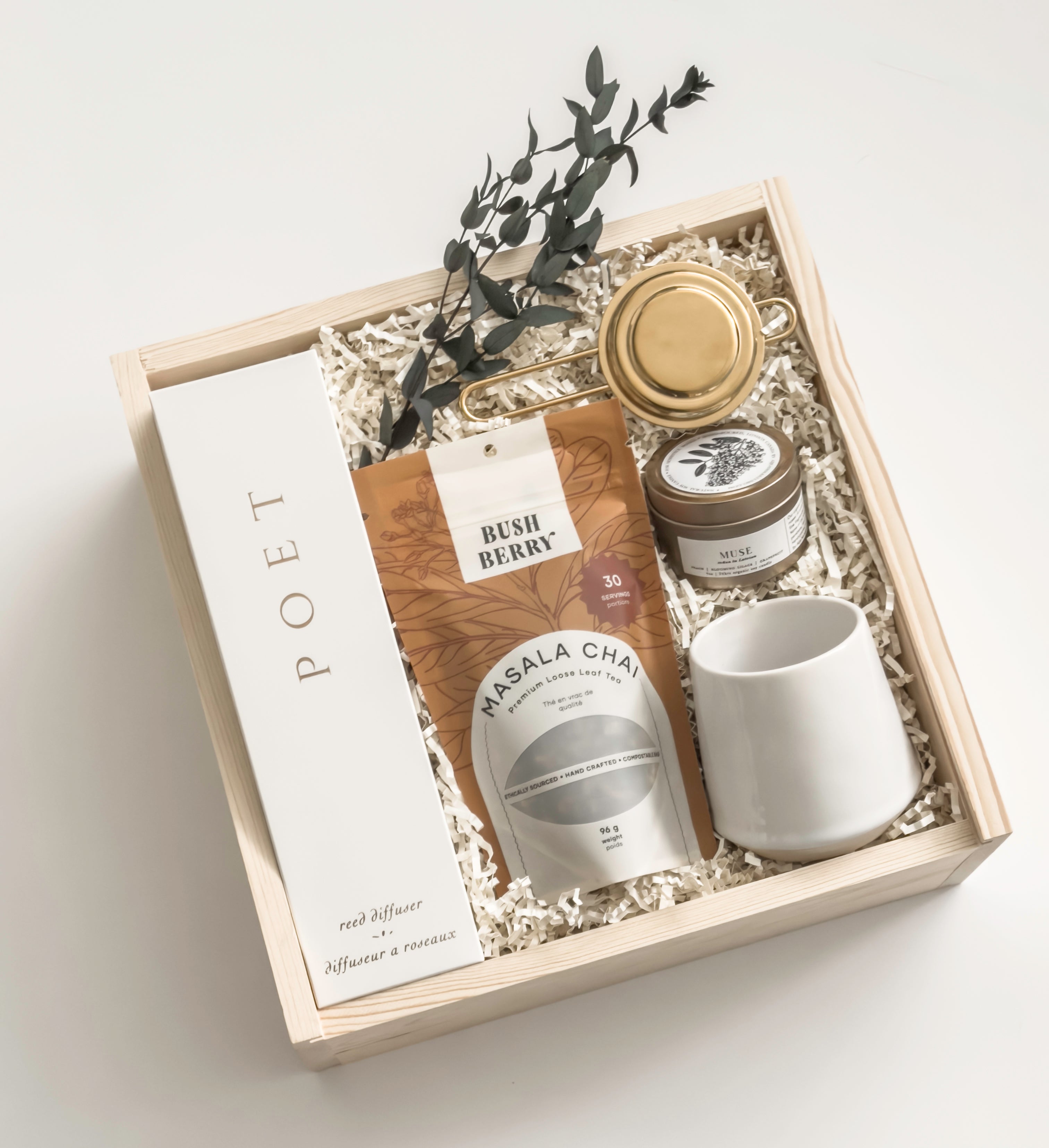 Warm Welcome realtor closing gift by Muse Baskets and Co. with Poet reed diffuser, Masala chai, gold tea steeper, soy candle and Fable mug in a Signature Luxe Wood Gift Box.