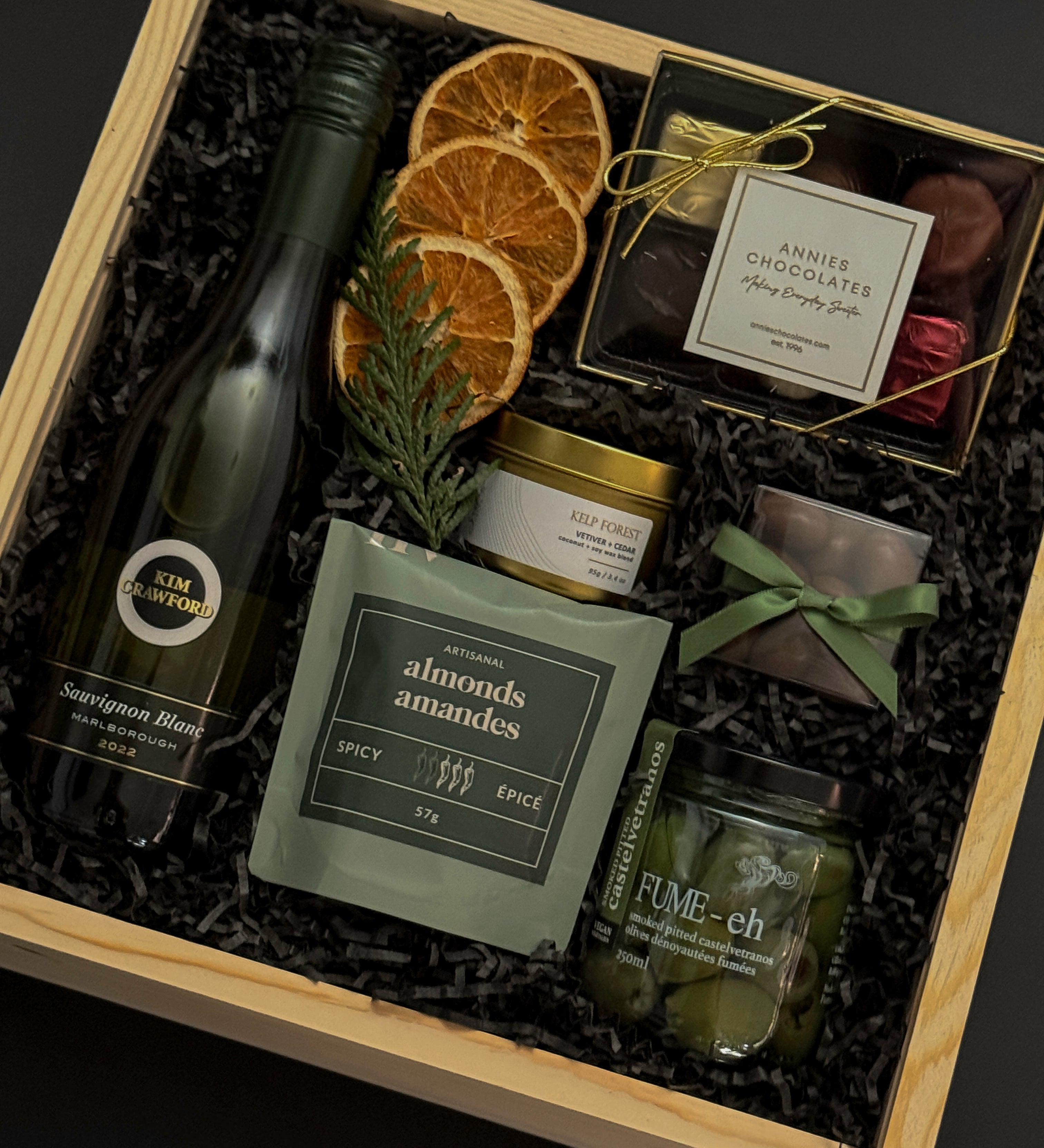 Corporate wine gift box with Kim Crawford Sauvignon Blanc, artisan foods, and festive accents.