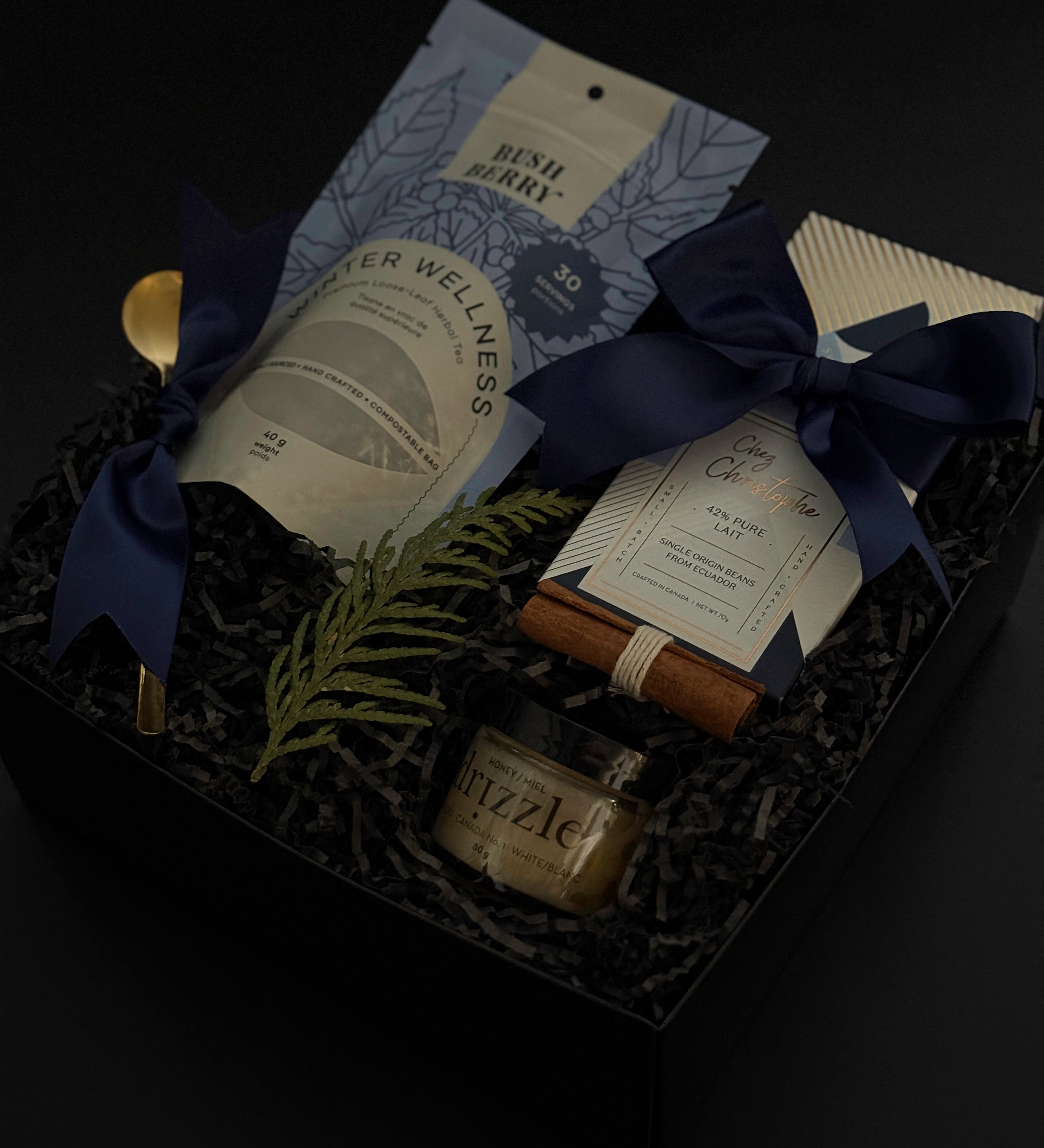 Luxury winter wellness gift box for corporate, client, and holiday gifting featuring artisan tea, chocolate, and seasonal details.