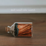 DARK WOOD MATCHES IN EARTHY MOUNTAINS