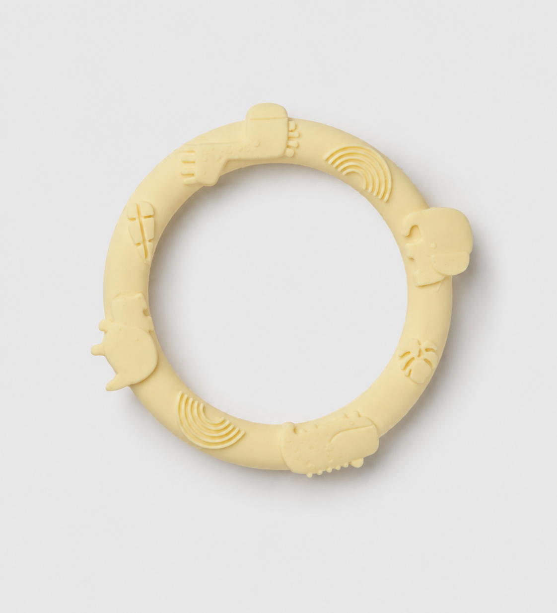 Yellow silicone teething ring on a light gray background