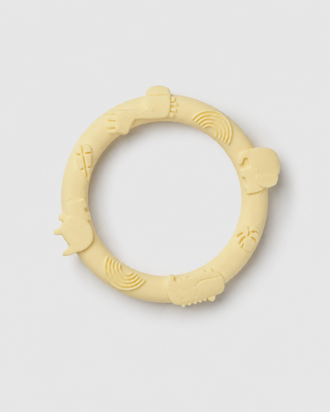 Yellow silicone teething ring on a light gray background
