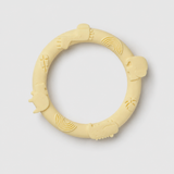 Yellow silicone teething ring on a light gray background
